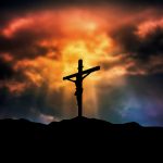 Silhouette of the crucifixion of Christ on the background of the